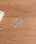 Get That Smooth Flow With SAFIGLE 40pcs Ballpoint Pen Springs Upgrade Kit, Stainless Steel Mini Compression Springs For Smooth Operation And Easy Replacement In Your Favorite Pens Today. silver springs on wood desk
