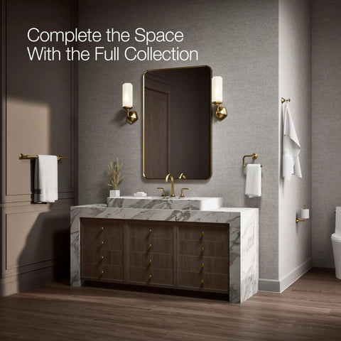 Occasion 27064-2MB Vertical Toilet Paper Holder In Vibrant Brushed Moderne Brass mounted near vanity in elegant bathroom.