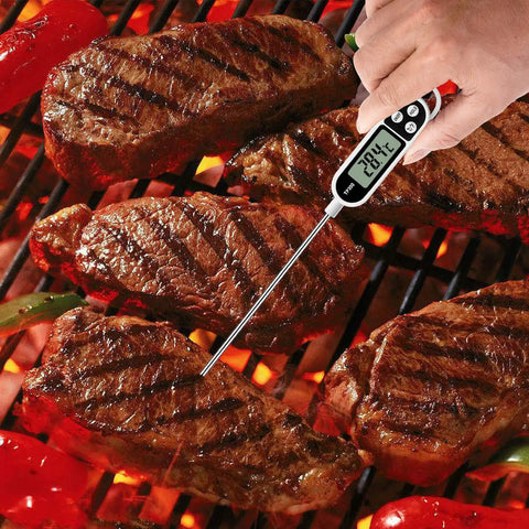 Using Digital Meat Thermometer For Cookin And BBQ With Long Probe to check steak temperature on grill with bright LCD display