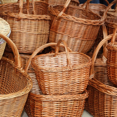 Wicker baskets crafted with Round Reed Spline 350 Ft Roll 0.14 Inch for DIY furniture and basket weaving projects.