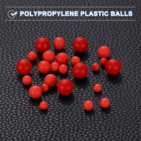 25 Piece Set Polypropylene Bearing Balls 14mm Red Plastic Rollers G2 Precision Frosted Finish scattered on dark background.