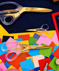 Go-To Everyday Office And Craft Scissors With Titanium Coated Blades And Clear Ergonomic Handles, Durable 3 Pack For Home Desk Or School Projects, Gold Finish For Sharp Clean Cuts, 3 gold scissors on colorful craft paper