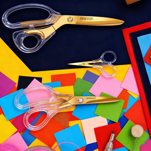 Go-To Everyday Office And Craft Scissors With Titanium Coated Blades And Clear Ergonomic Handles, Durable 3 Pack For Home Desk Or School Projects, Gold Finish For Sharp Clean Cuts, 3 gold scissors on colorful craft paper