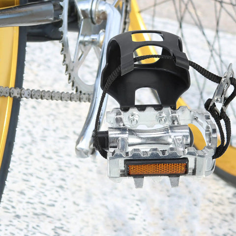 Non Slip Bicycle Pedals With Half Inch Spindle Platform Toe Clips And Adjustable Foot Straps For Indoor And Outdoor Cycling Durable Grippy For Any Ride, close-up view.