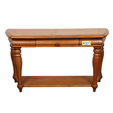 Wooden console table with a price tag, featuring carved legs and a single drawer, front view.