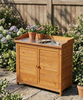 Outdoor Garden Wood Storage Cabinet With Waterproof Tool Shed, Potting Benches And Workstation Table in Natural Finish on patio