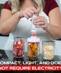 Person using Mason Jar Vacuum Sealer Accessory Set with Cordless Hand Pump on dried fruits in mason jars
