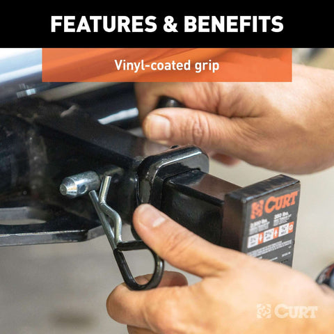 Person installing trailer hitch pin and clip with vinyl coated grip half inch diameter fits one and one quarter inch receiver