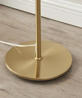 Base of Rowan Brass Floor Lamp With Unique Thread Shade, showing round brass base on wooden floor.
