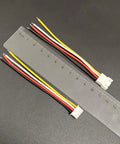 XH 2.54mm 4 Pin Male and Female Connector Kit with 10cm 22 AWG Soft Silicone Wires shown with ruler for scale