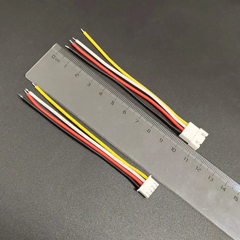 XH 2.54mm 4 Pin Male and Female Connector Kit with 10cm 22 AWG Soft Silicone Wires shown with ruler for scale