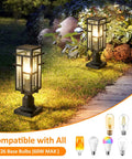 Outdoor Dusk To Dawn Post Light Set In Matte Black With Clear Glass Panels illuminating garden path at night