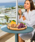Woman enjoying coffee with 12 Inch Lazy Susan With Umbrella Hole For Outdoor Patio Table No Fuss 360 Degree Rotation Iron Turntable Organizer For Beach Umbrellas Patio Garden And Poolside Dining holding fruits on table