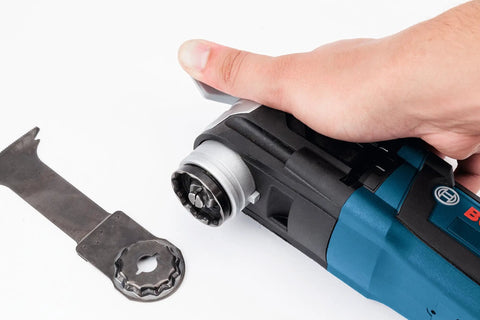 Hand installing blade on 5 Piece Starlock Oscillating Multi Tool Blade Set For Metal Wood And General Materials With Assorted Plunge Blades