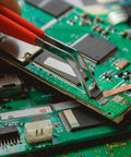 Person using Six Pack 5Ft Solder Wick Braided Desoldering Wicks With Flux No Clean For Electronics PCB Repair on circuit board