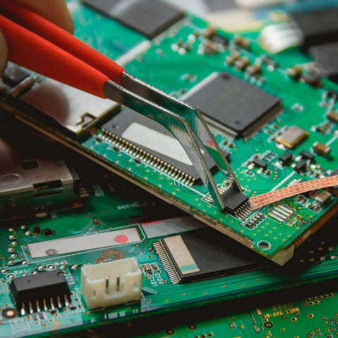 Person using Six Pack 5Ft Solder Wick Braided Desoldering Wicks With Flux No Clean For Electronics PCB Repair on circuit board
