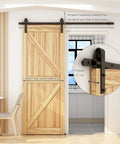 6 Foot Sliding Barn Door Hardware Kit With Floor Guide And Spring Damping Stopper installed on wooden door, interior view