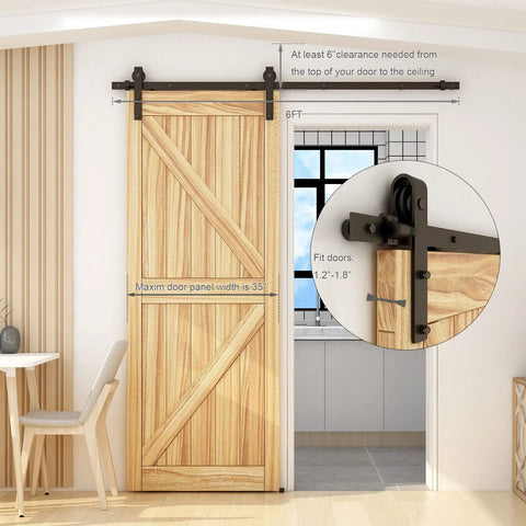 6 Foot Sliding Barn Door Hardware Kit With Floor Guide And Spring Damping Stopper installed on wooden door, interior view
