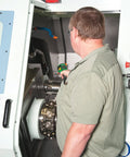 Man using Non Contact Infrared Thermometer With Dual Laser Targeting for precise readings on machine surfaces, HVAC