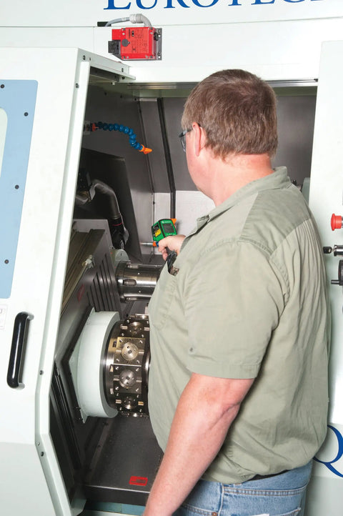 Man using Non Contact Infrared Thermometer With Dual Laser Targeting for precise readings on machine surfaces, HVAC