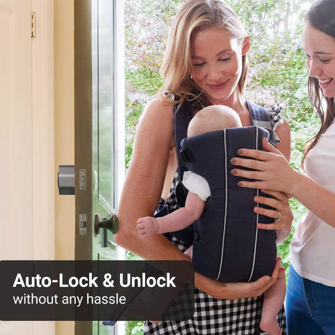 Aegis Smart Door Lock With WiFi Gateway, Auto Unlock And Auto Lock, shown installed on a door, with a mother holding a baby nearby.