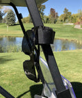 Black Magnetic Rangefinder Strap with sunglasses attached on golf cart rail for hands-free access on the course.