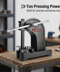 Heavy Duty Cast Iron Arbor Press With Steel Anvil For Center Punch And Ring Making This Rock Solid Workspace Essential on workbench.