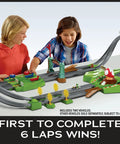 Kids playing with Hot Wheels Mario Kart Circuit Track Set With 2 Die Cast Vehicles, High Speed Racing Playset Featuring Mario And Yoshi Karts