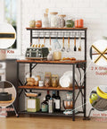 Rustic Brown Kitchen Bakers Rack With Power Outlets And A 31.5 Inch Desktop Four Tier Storage Coffee Bar Station With Eight S Hooks Microwave And Spice Organizer For Pots And Appliances displayed in kitchen setup