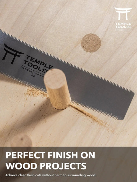 Heavy Duty Six Inch Japanese Flush Cut Saw With Double Edge Pull Design cutting flush with dowel in wood surface.