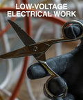 Electrician Scissors With Stripping Notches Nickel Plated 5.25 Inch Snips For Datacom Telecom Electrical And Heavy Duty Use Made In USA Built Tough For Pro Grade Worksite Reliability, held in hand against blurred background.