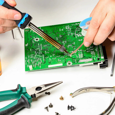 Person using Six Pack 5Ft Solder Wick Braided Desoldering Wicks With Flux No Clean For Electronics PCB Repair Blue 0.1 Inch Wide