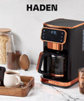 Heavy Duty 12 Cup Dual Brew Coffee Maker Built For Hot And Cold Brewing, sleek black with copper accents on kitchen counter.