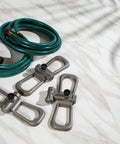 Port-A-Rain Above-Ground Sprinkler System with 2 hoses and 3 sprinklers on marble surface for flexible yard watering setup.