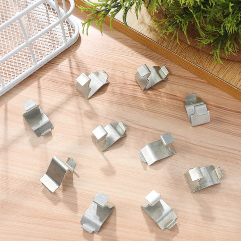 Heavy Duty Metal Shelf Clips With Super Sturdy Adjustable Mounts For Closets And Bookshelves arranged on wood surface.