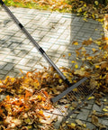 Workhorse Heavy Duty Lawn Rake With Telescoping Handle, 21 Tines Stainless Steel Head on patio with leaves