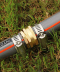 5/8 Inch Aluminum Garden Hose Repair Kit With Female And Male Connectors And Stainless Steel Clamps in use on lawn