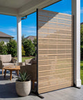 Sturdy 6Ft Outdoor Privacy Screen in patio setting, heavy-duty 37Lb freestanding metal panel with louvered faux wood look.