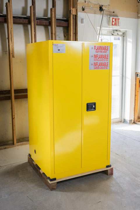 Heavy Duty 60 Gallon Flammable Safety Cabinet With Automatic Door, yellow steel design, used for combustible liquid storage.