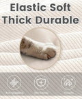 Close-up of corduroy material texture, emphasizing softness and durability with a cat's paw, for Oversized Modular Sectional Sofa With Movable Ottoman 112 Inch Four Seat L Shaped Corduroy Couch In Beige Convertible Living Room And Home Office Setup.