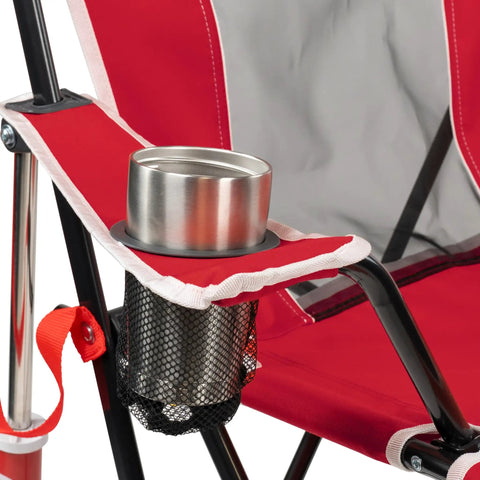 Comfort Pro Rocker Camping Chair With Drink Holder detail showing cup slot, red fabric, black frame, and mesh pocket.
