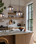 Globe Pendant Lights Set of 3 Hand Blown Glass With Clear Seeded Bubbles above kitchen island, brushed nickel canopy