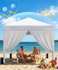 Easy Up 10x10 Pop Up Canopy With Sidewalls One Push Instant Setup In A Snap on a beach, providing shade for family activities.