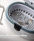 Top Rated Ultrasonic Jewelry Cleaner Delivers A Slick Shine To Eyeglasses Watches Rings Coins Razors And Gadgets Using Just Tap Water For Quick Deep Cleaning That Really Slaps And Leaves Everything Crisp. Interior view with jewelry in stainless tank.