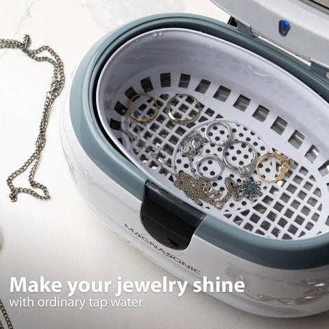 Top Rated Ultrasonic Jewelry Cleaner Delivers A Slick Shine To Eyeglasses Watches Rings Coins Razors And Gadgets Using Just Tap Water For Quick Deep Cleaning That Really Slaps And Leaves Everything Crisp. Interior view with jewelry in stainless tank.
