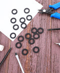 Rubber Washers For Hose And Shower Head Half Inch Seal Kit 24 Pack 19Mm OD 11Mm ID 2Mm Thick Leak Proof Seals on wooden surface