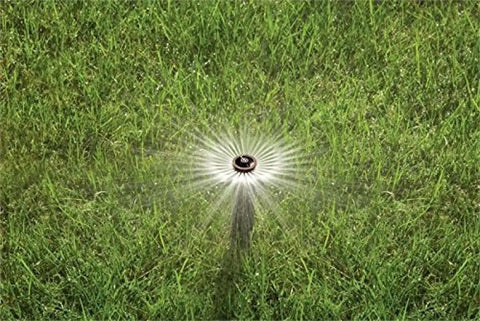 Four Inch Pop Up Sprinkler Heads Set Of Five With Adjustable 0 To 360 Degree Arc Nozzle Pattern, Up To 15 Foot Spray Distance, 1/2 Inch NPT Threaded Inlet For Lawn And Garden Irrigation in action in green lawn