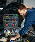 Grease Monkey Approved 30 Piece Coolant Pressure Testing Kit With Radiator Cap Adapters and tools being used on a vehicle engine.