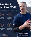 MVP quarterback wearing arm sleeve holding football, promoting copper-infused 4-way stretch lightweight fit and moisture wicking benefits.