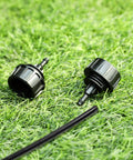 Five Pack One Quarter Inch Drip Irrigation Tubing To Faucet And Garden Hose Adapters Quick Connect Fittings on grass